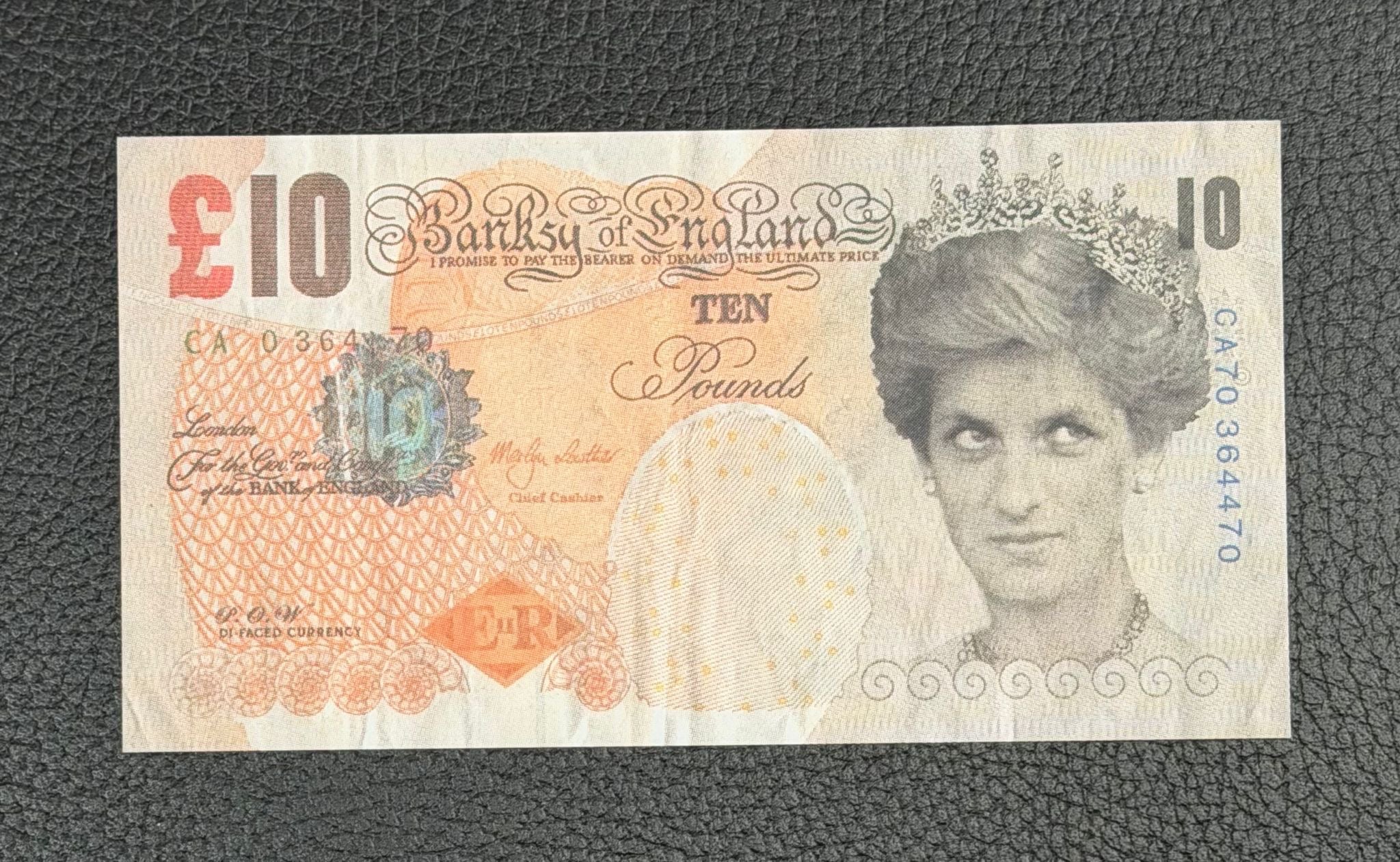 alt="Genuine Banksy Di-Faced Tenner, full front view, authentic street art print"