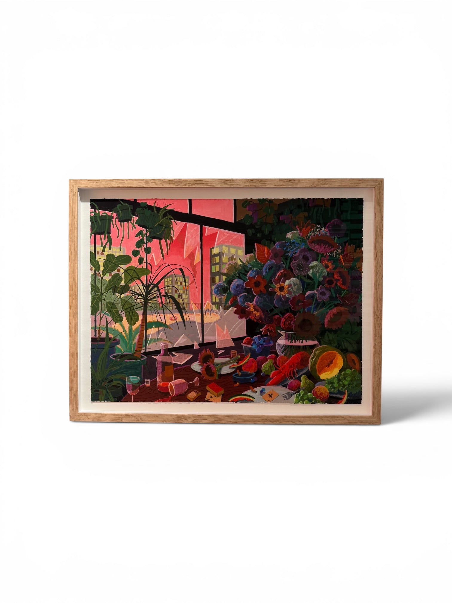 A framed still life painting featuring a vibrant floral arrangement, fruit, and a pink-toned window view, presented in a light wood frame against a white background.