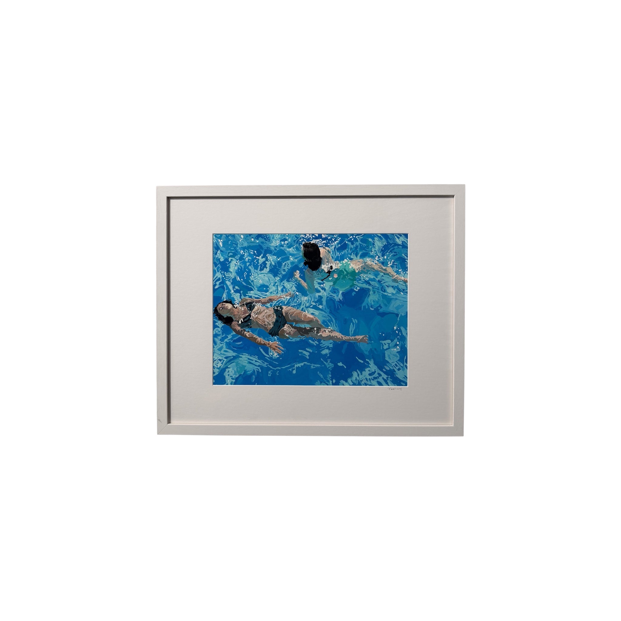 A framed art print featuring an overhead photograph of two people swimming in a bright blue pool, set in a light gray frame against a white background.