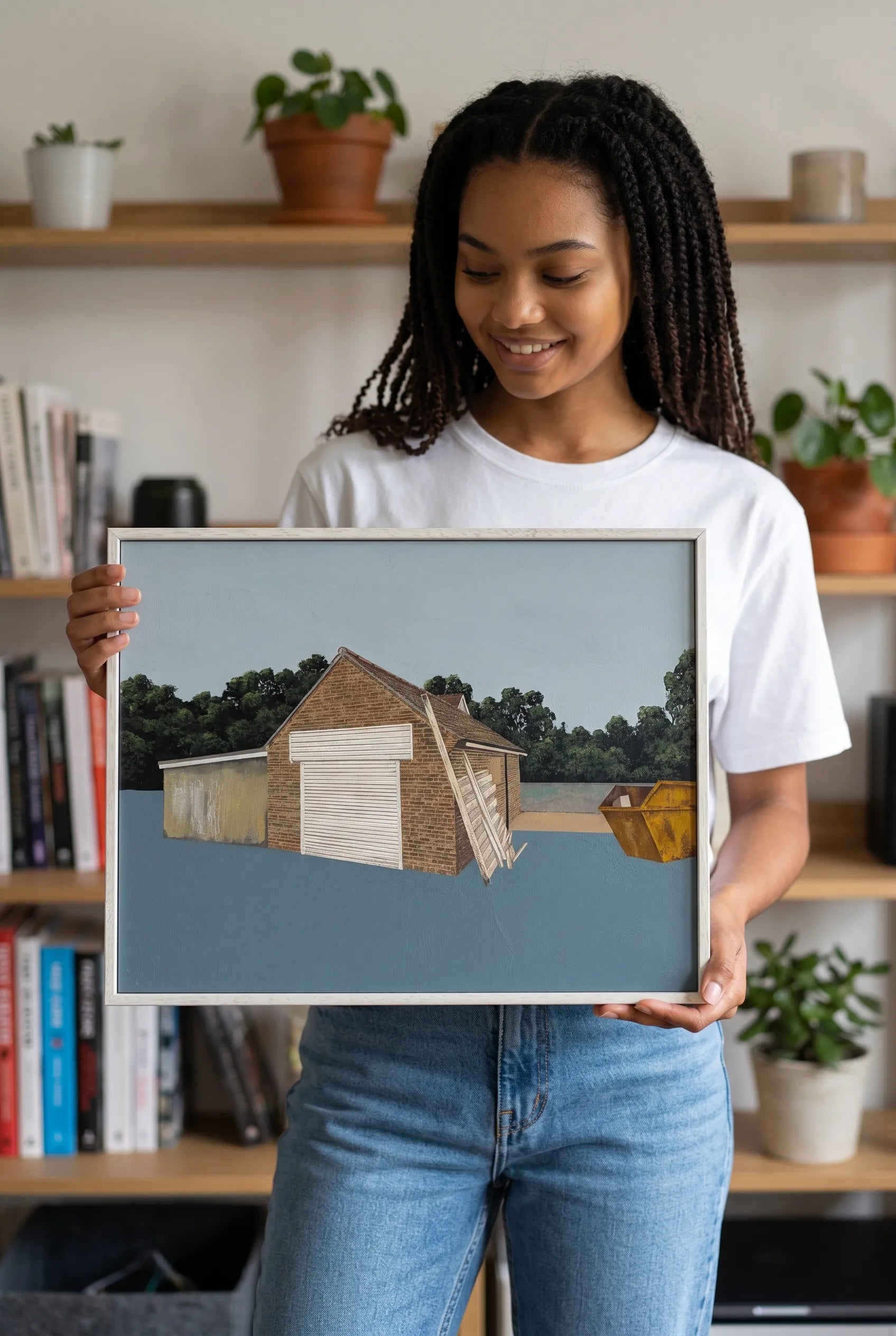 Person holding a framed Jack Candy-Kemp artwork showing the size of the framed work
