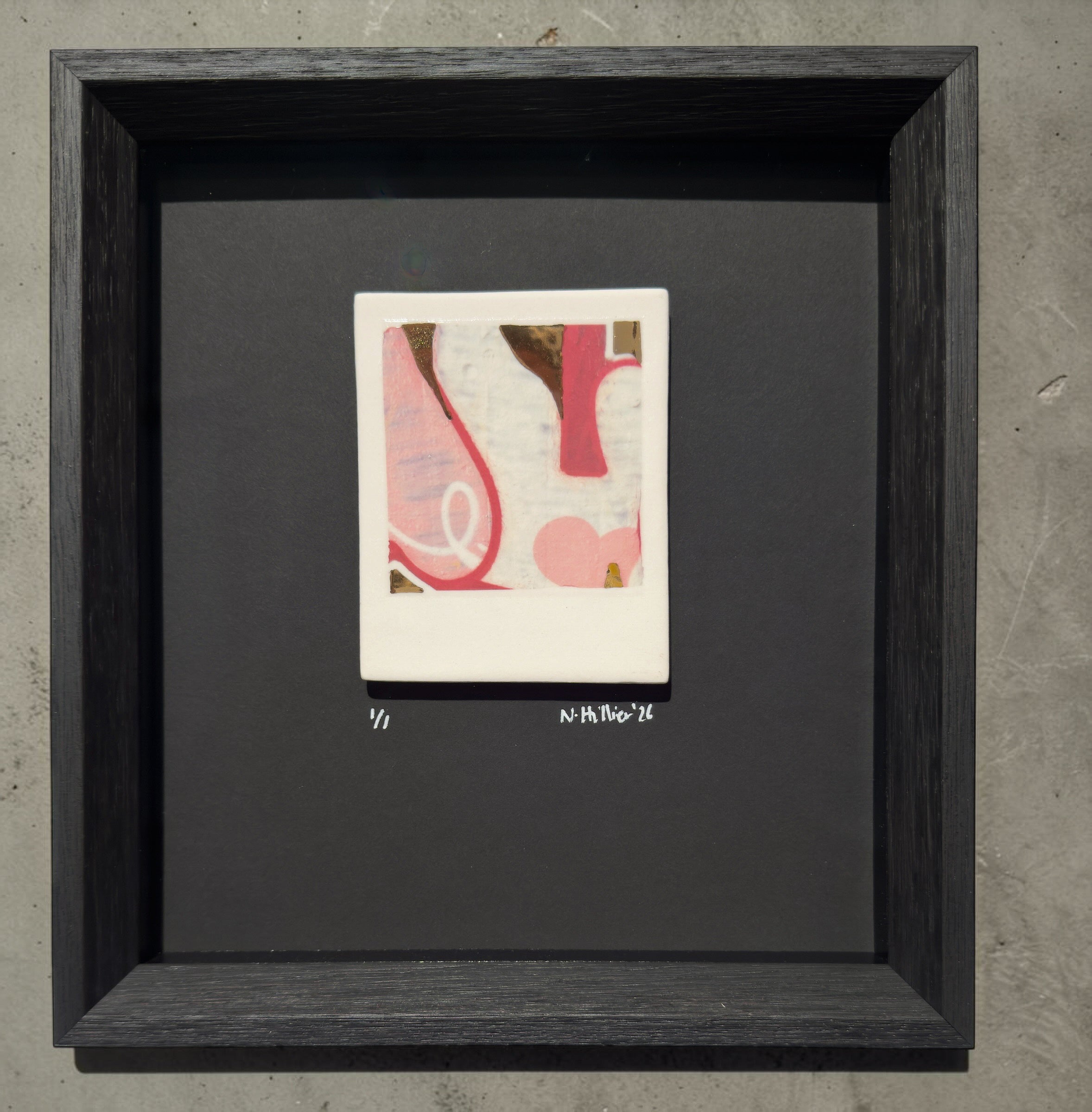 Framed abstract artwork, street art tagging on porcelain with pink and brown elements on a gray background