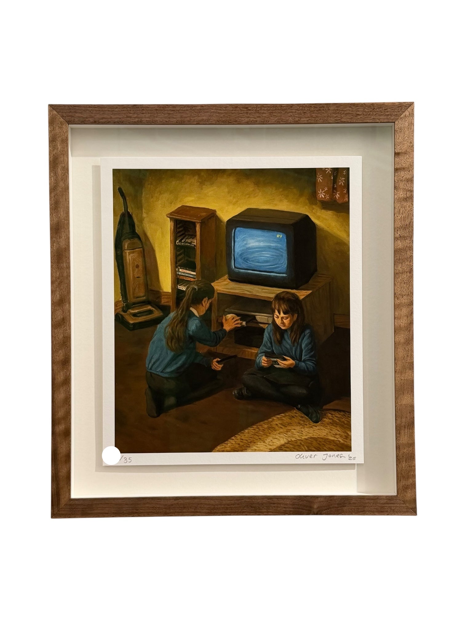 A framed art print featuring a painting of two children in a dimly lit room looking at a television set, presented in a brown wood frame with a white mat border.