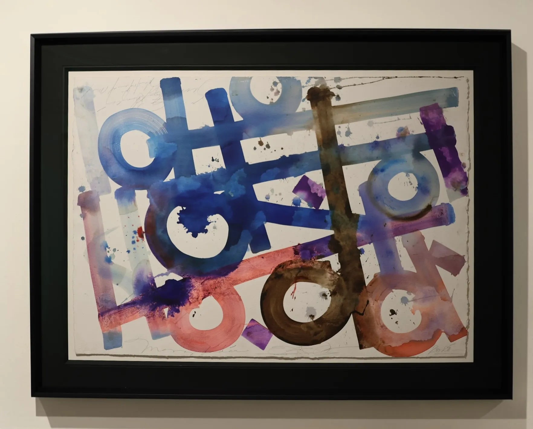 Framed abstract artwork by Retna with colourful letters on a beige background, framed beautifully 