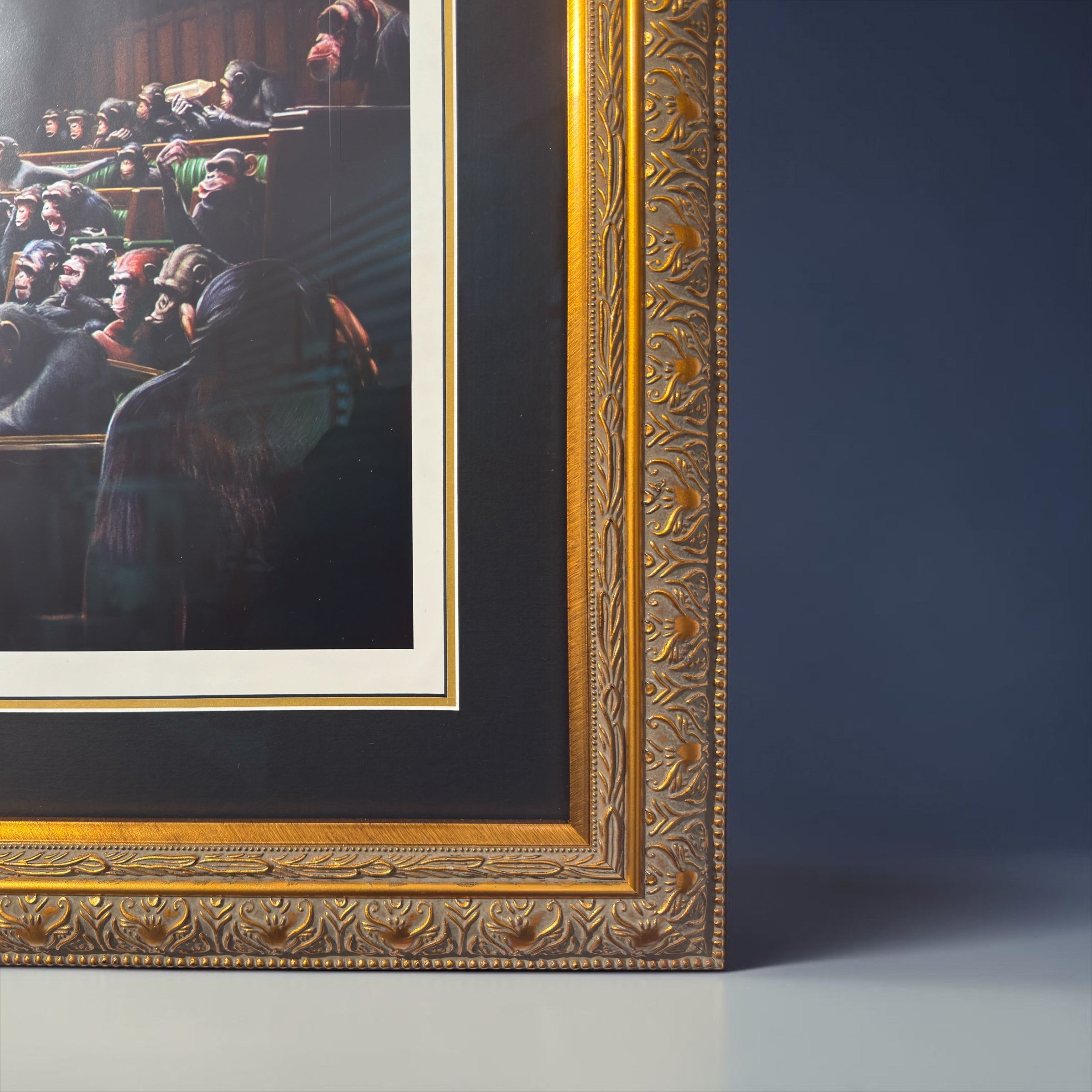 Framed Banksy Monkey Parliament print, iconic political satire street art piece, available for purchase. Devolved Parliament.