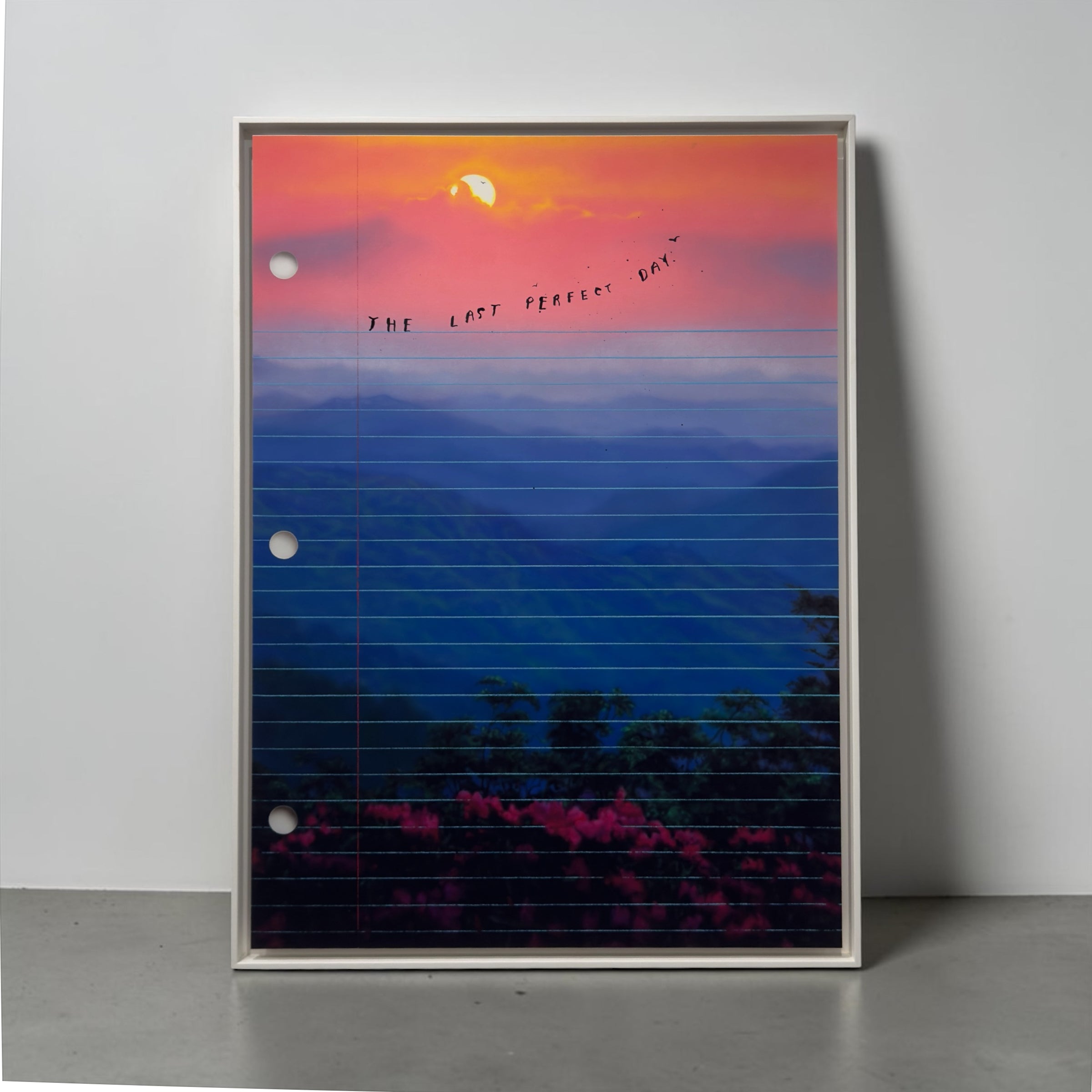 Framed artwork of a sunset over mountains, blue and orange hues with 'The Last Perfect Day' text. Limited edition art print of The Last Perfect Day by Friedrich Kunath, featuring a surrealist landscape with a vibrant sunset and poetic themes, high-quality archival giclée print.