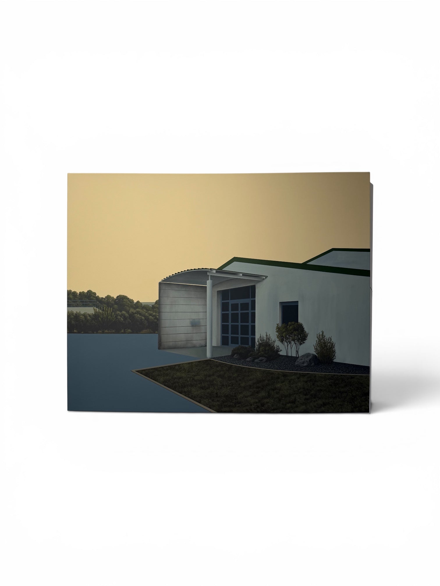 A square canvas wall art print depicting a modern white garage and shed under a warm golden-yellow evening sky, shown on a clean white background.