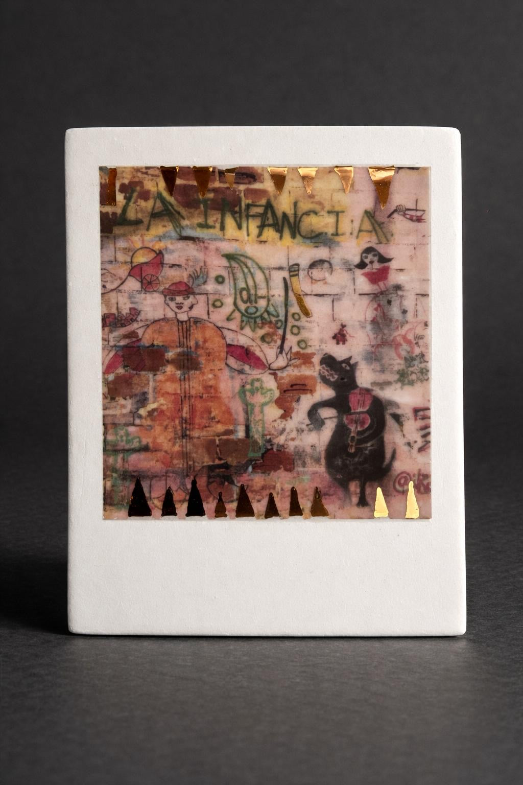 Small incised photographic ceramic decal on porcelain with real gold application by artist Nadia Hillier, showcasing contemporary design.