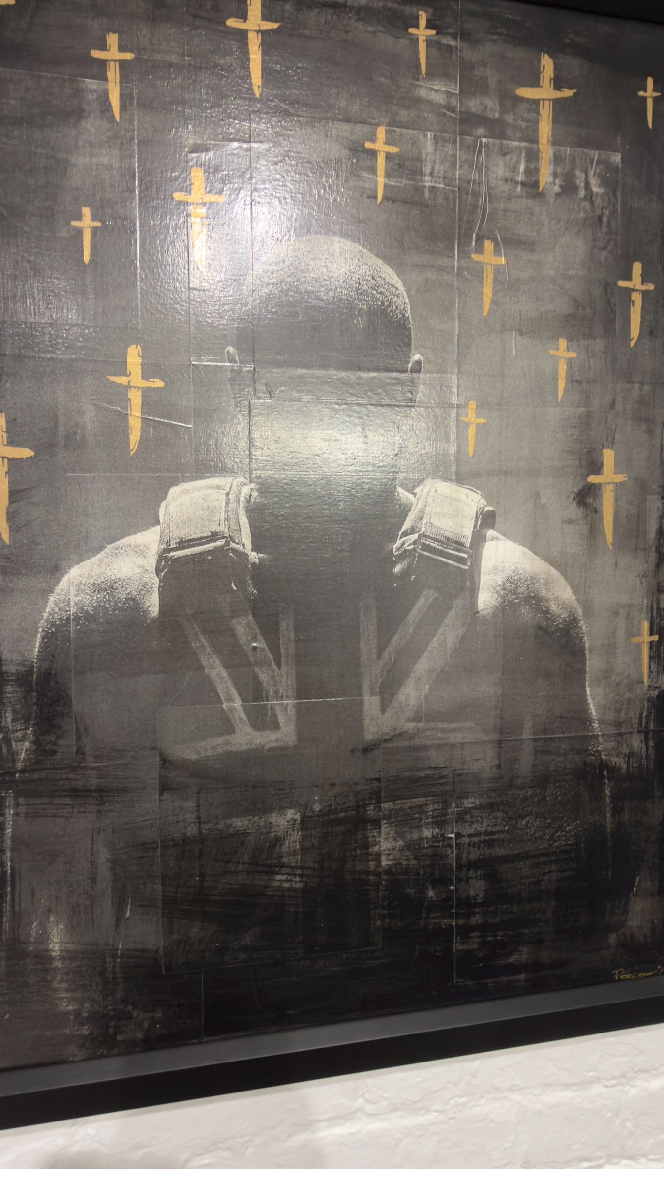 Mixed media artwork titled "Still Time" by Percent featuring nineteen blades and Stormzy in a stab vest, displayed in a black frame, angled picture.